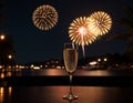 Glasses of champagne on a table with fireworks in the background