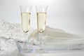 Glasses with champagne and wedding dress on a white background Royalty Free Stock Photo