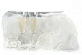 Glasses with champagne and wedding dress on a white background Royalty Free Stock Photo