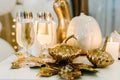 Glasses of champagne with wedding rings. Luxury elegant wedding decor for the ceremony. Autumn style. Engagement. White balloons, Royalty Free Stock Photo