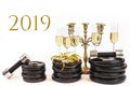 Glasses of champagne on weight plates and dumbbells. Concept for new years resolution 2019