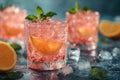 Glasses of cocktail Pink Flamingo with ice cubes and lemon slice