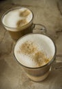Glasses of coffee with foamed milk