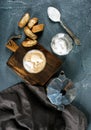 Glasses of coffee with ice cream on rustic wooden board, steel Italian Moka pot over grey concrete textured background Royalty Free Stock Photo