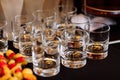 Glasses with cognac, whiskey stand on the bar. a lot of glasses with cognac. alcohol in the glasses. Various alcohol drinks Royalty Free Stock Photo