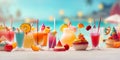 Glasses with cold refreshing summer drinks. Ice lemonade, smoothie and sweet cakes on sand beach over sea water and blue sky