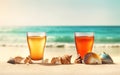 Glasses with cold refreshing summer drinks. Ice lemonade and tea on sand beach with shells over blue water and sky background.