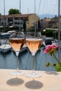 Drinking of French brut champagne sparkling wine in glasses, club party in yacht harbour of Port Grimaud near Saint-Tropez, French Royalty Free Stock Photo