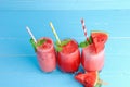 3 glasses cold watermelon juice smoothie refreshing drinks for a healthy summer on blue background Royalty Free Stock Photo