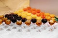 Glasses with colored drinks on a white table Royalty Free Stock Photo