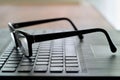 Glasses on the computer keyboard Royalty Free Stock Photo