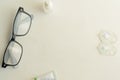 Glasses ,contact lens packaging ,tube of eye ointment and small bottle of eye drops on white background.Top view,space