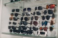 Glasses on the counter in the optics store. Eyeglasses goggles sunglasses on shop.