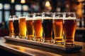 Glasses with craft beer on wooden bar. Royalty Free Stock Photo