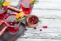 Glasses with cranberry juice. Cranberries, limes, rosemary. On a rustic background. Top view. Royalty Free Stock Photo