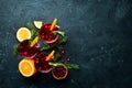 Glasses with cranberry juice. Cranberries, limes, rosemary. On a rustic background. Top view. Royalty Free Stock Photo