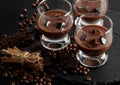 Glasses of cream coffee cocktail or chocolate martini on black b Royalty Free Stock Photo