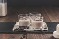 Glasses of Cream coffee liqueur with ice, and coffee  beans on rustic wooden background Royalty Free Stock Photo