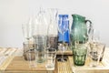 Glasses, cups, bottles and glass jars of different colors Royalty Free Stock Photo