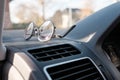 Glasses on the dashboard of a car. Accessory for drivers with vision problems. Road safety concept.