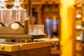 Glasses and decanters for wine on a wooden stand