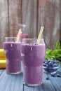 Glasses of delicious blueberry smoothie