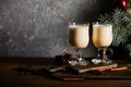 Glasses with delicious eggnog drink on