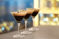 Glasses of delicious Espresso Martini on bar counter