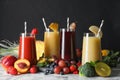 Glasses of delicious juices and fresh ingredients on white marble table Royalty Free Stock Photo