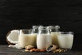 Glasses with diferent types milk on wooden background