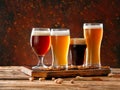 Glasses with different fresh beer on table Royalty Free Stock Photo