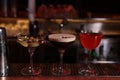 Glasses of different Martini cocktails on bar counter Royalty Free Stock Photo
