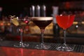 Glasses of different Martini cocktails on bar counter Royalty Free Stock Photo