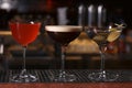 Glasses of different Martini cocktails on bar counter Royalty Free Stock Photo