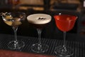 Glasses of different Martini cocktails on bar counter Royalty Free Stock Photo