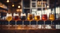 Glasses with different sorts of craft beer on wooden bar. Royalty Free Stock Photo