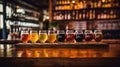 Glasses with different sorts of craft beer on wooden bar. Tap beer in pint glasses arranged in a row Royalty Free Stock Photo