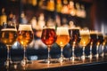 Glasses with different sorts of craft beer on wooden bar Royalty Free Stock Photo