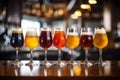 Glasses with different sorts of craft beer on wooden bar Royalty Free Stock Photo