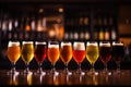 Glasses with different sorts of craft beer on wooden bar Royalty Free Stock Photo