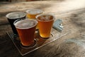 Glasses of different type of beer on the wooden table