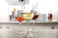 Three glasses with wine on kitchen table Royalty Free Stock Photo