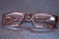 Glasses with diopters for vision on a gray background.