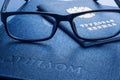 Glasses on diploma of higher education and employment history book Royalty Free Stock Photo