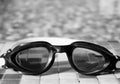 Glasses for diving on the edge of a summer pool Royalty Free Stock Photo