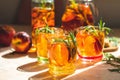 Glasses with drops of sweet peach iced tea