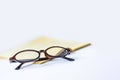 Glasses end book on white background Royalty Free Stock Photo