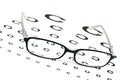 Glasses on a eye sight test chart Royalty Free Stock Photo