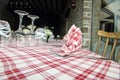 Glasses, fork and knife on red and white checked gingham tablecl Royalty Free Stock Photo