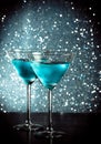 Glasses of fresh blue cocktail with ice on bar table Royalty Free Stock Photo